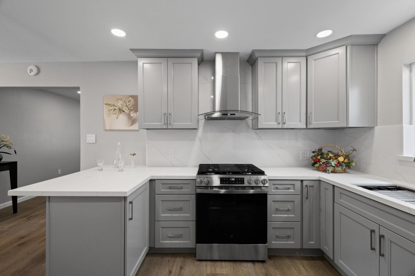227 Lippert Avenue Fremont, CA 94539 - Photo 11 of 25 a kitchen with a sink stove and cabinets
