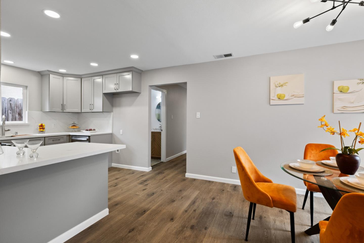 227 Lippert Avenue Fremont, CA 94539 - Photo 12 of 25 a kitchen with stainless steel appliances a dining table chairs and wooden floor