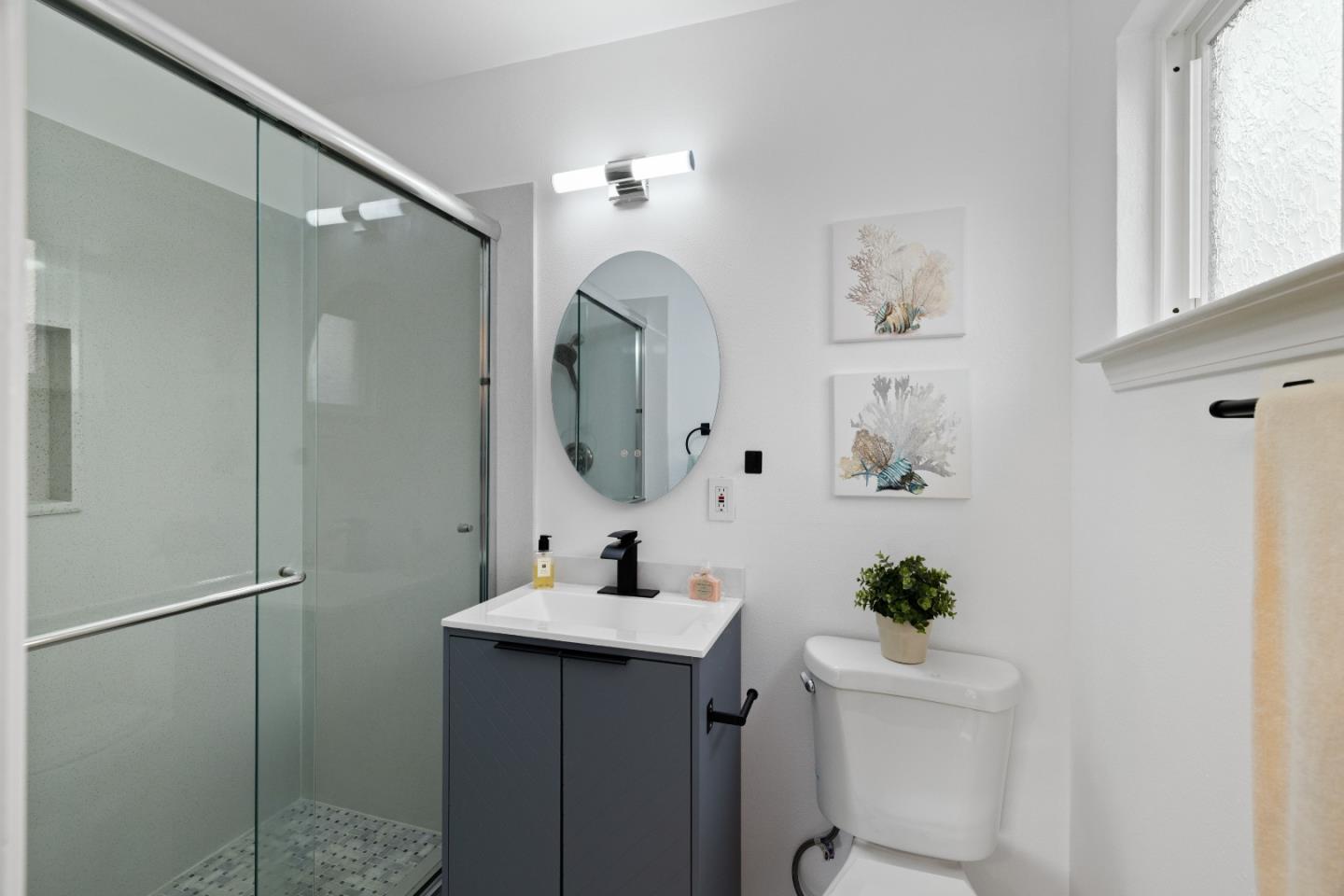 227 Lippert Avenue Fremont, CA 94539 - Photo 14 of 25 a bathroom with a toilet sink and mirror