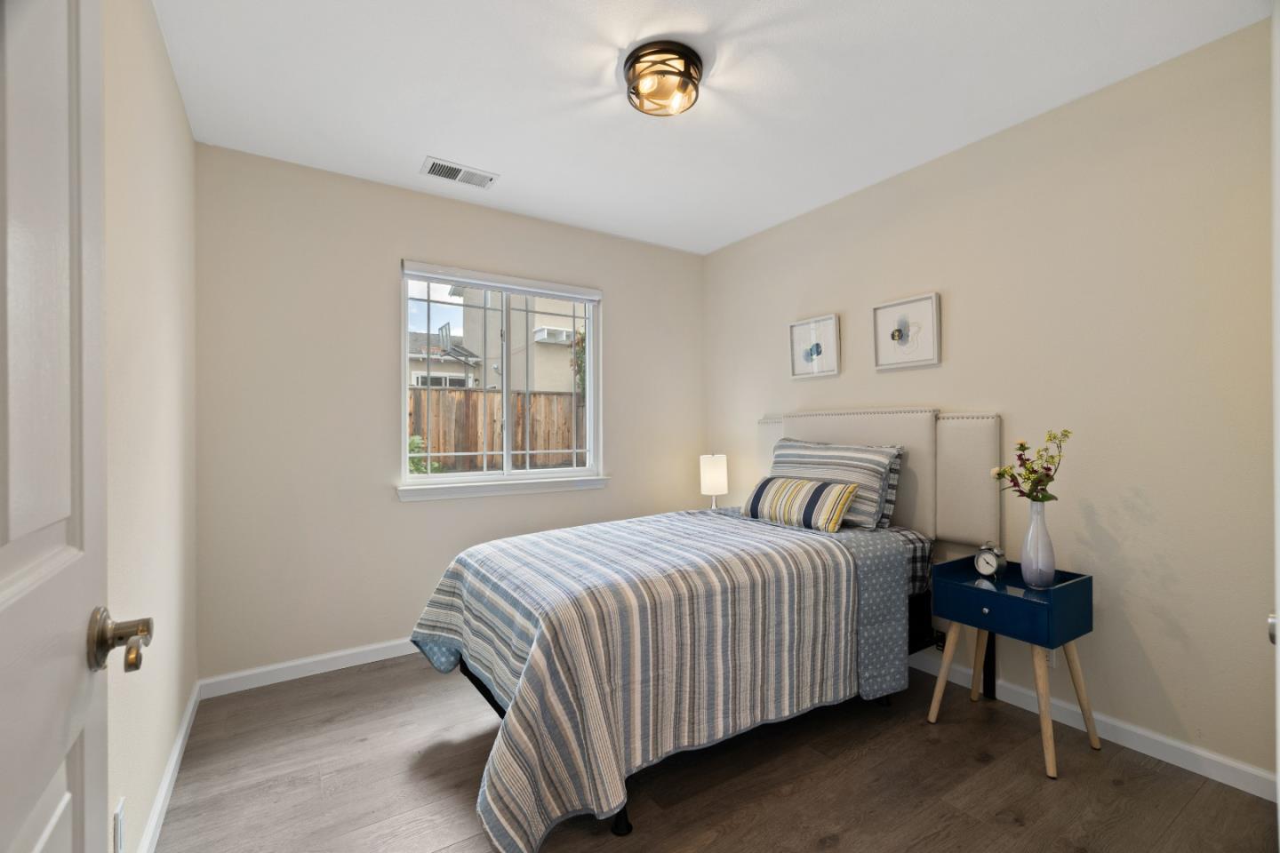 227 Lippert Avenue Fremont, CA 94539 - Photo 15 of 25 a bedroom with a bed and a window