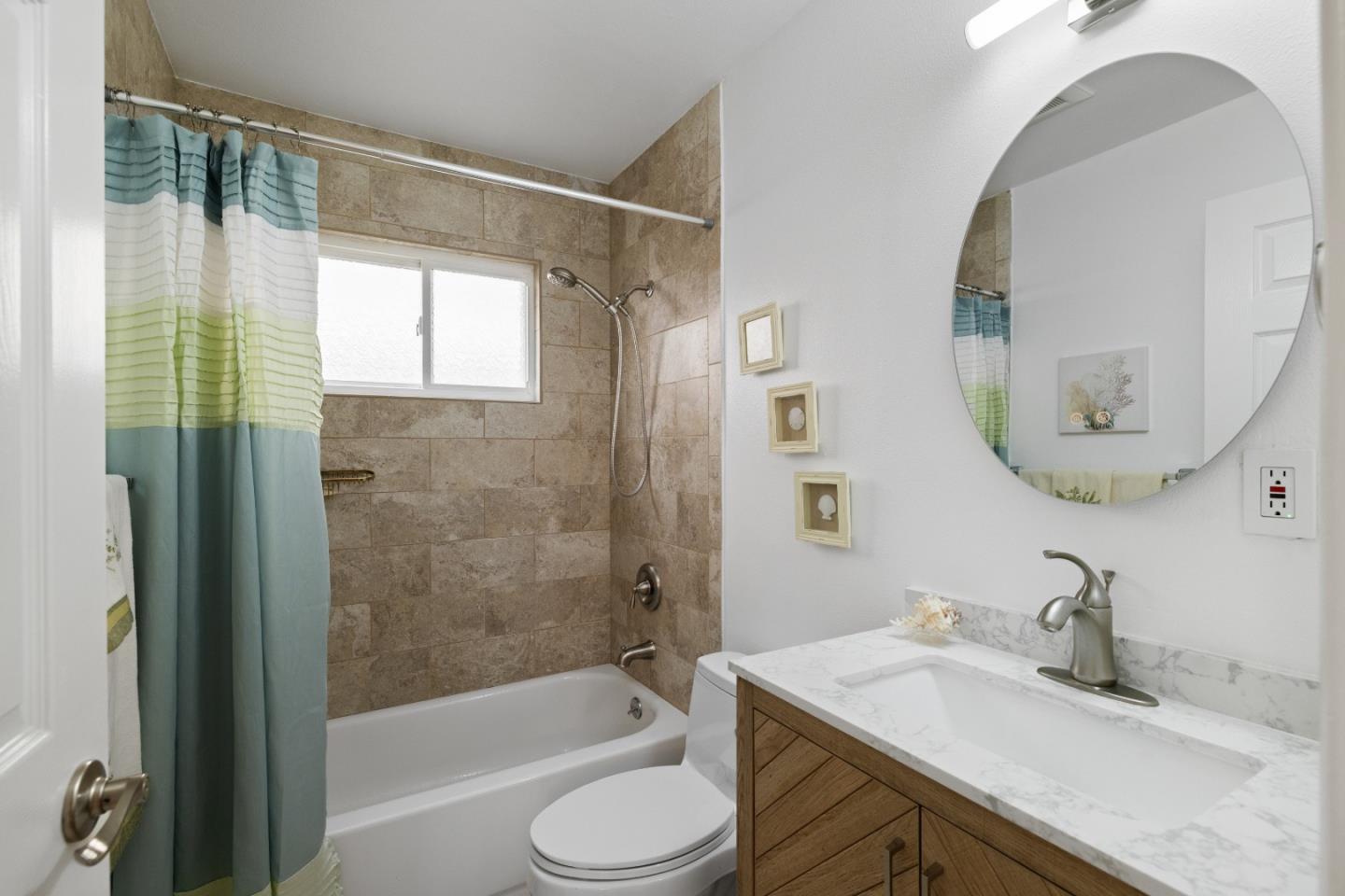 227 Lippert Avenue Fremont, CA 94539 - Photo 17 of 25 a bathroom with a sink a toilet and a mirror