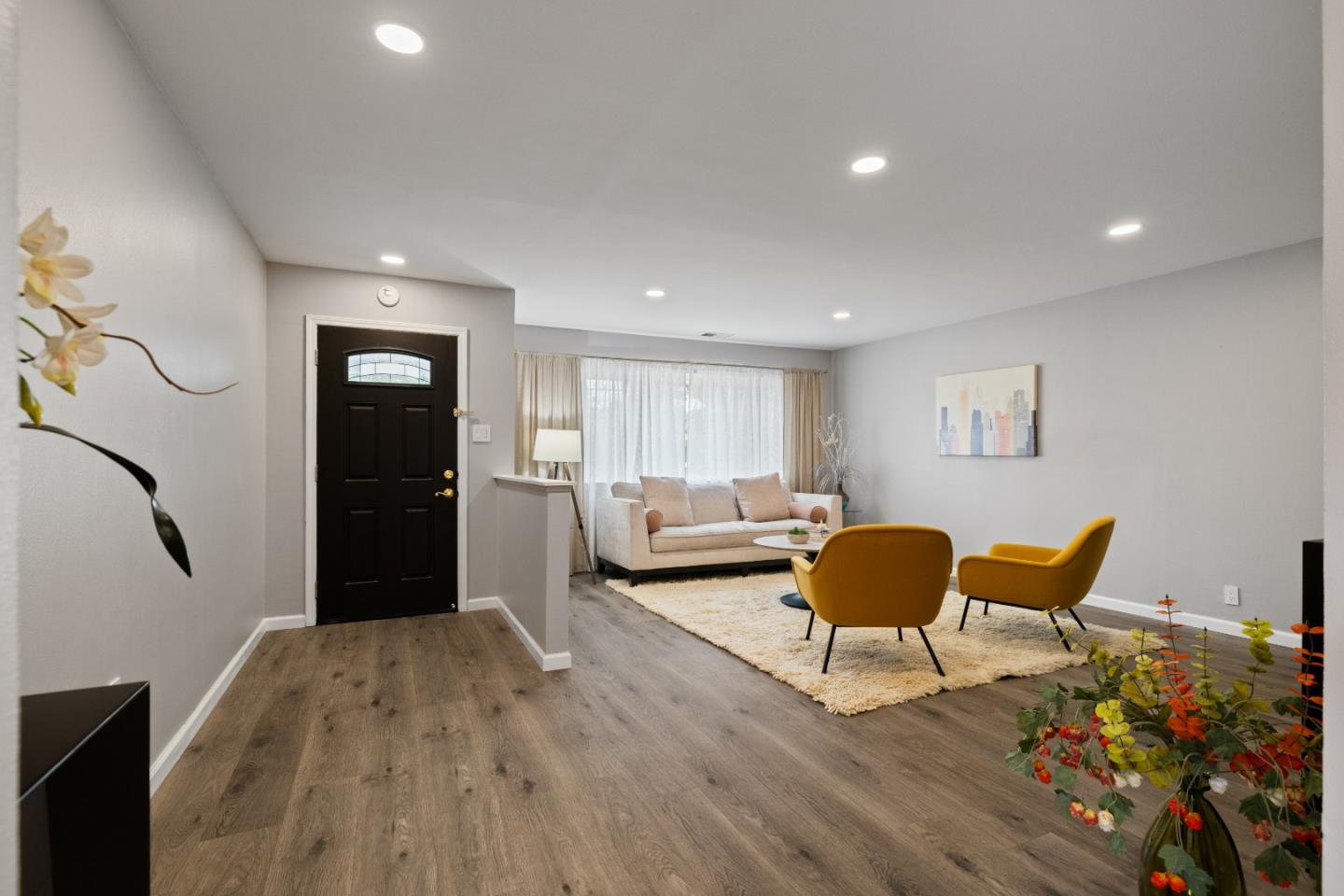 227 Lippert Avenue Fremont, CA 94539 - Photo 2 of 25 a living room with furniture and a wooden floor