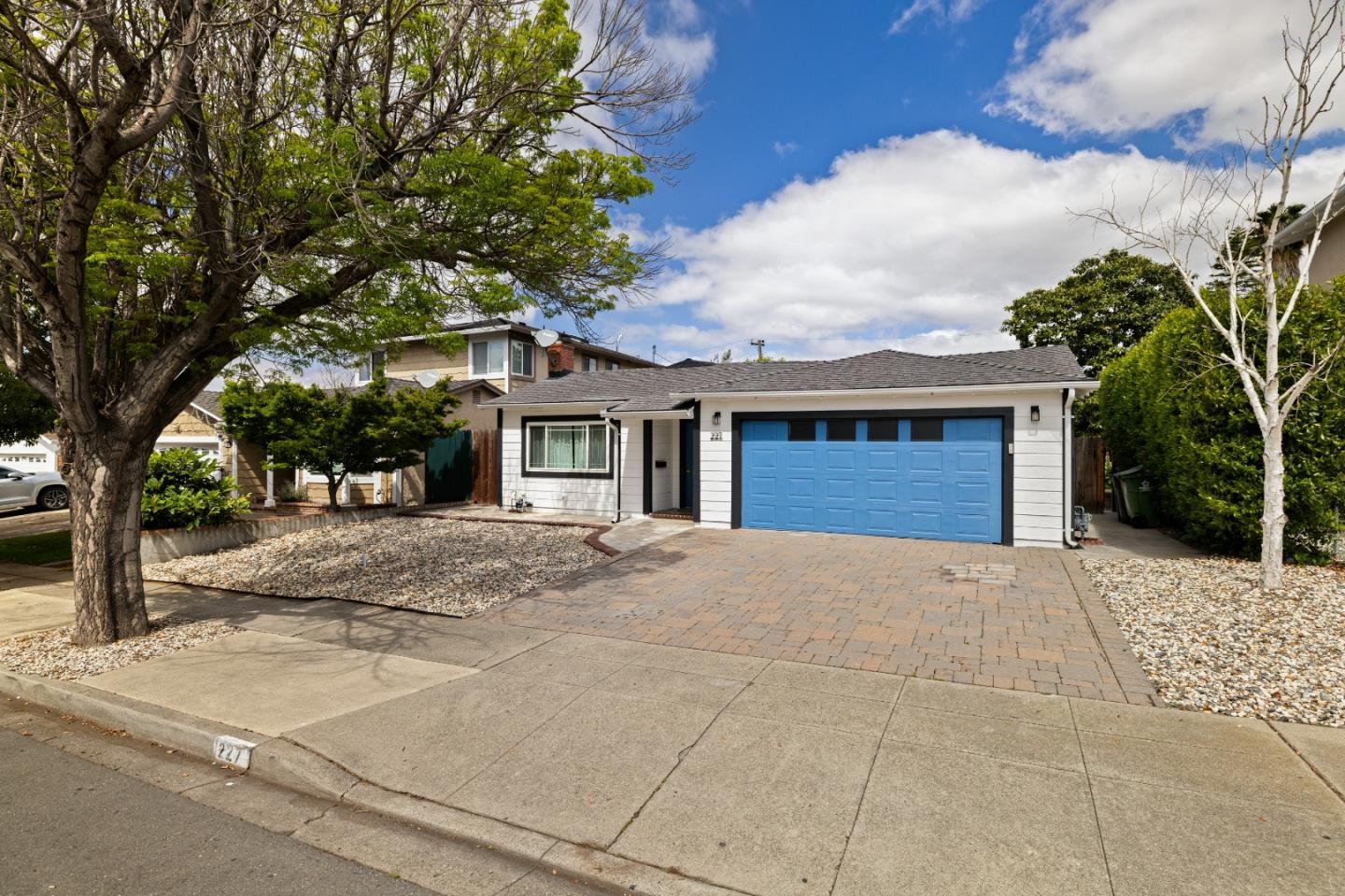 227 Lippert Avenue Fremont, CA 94539 - Photo 24 of 25 a front view of a house with a yard and garage