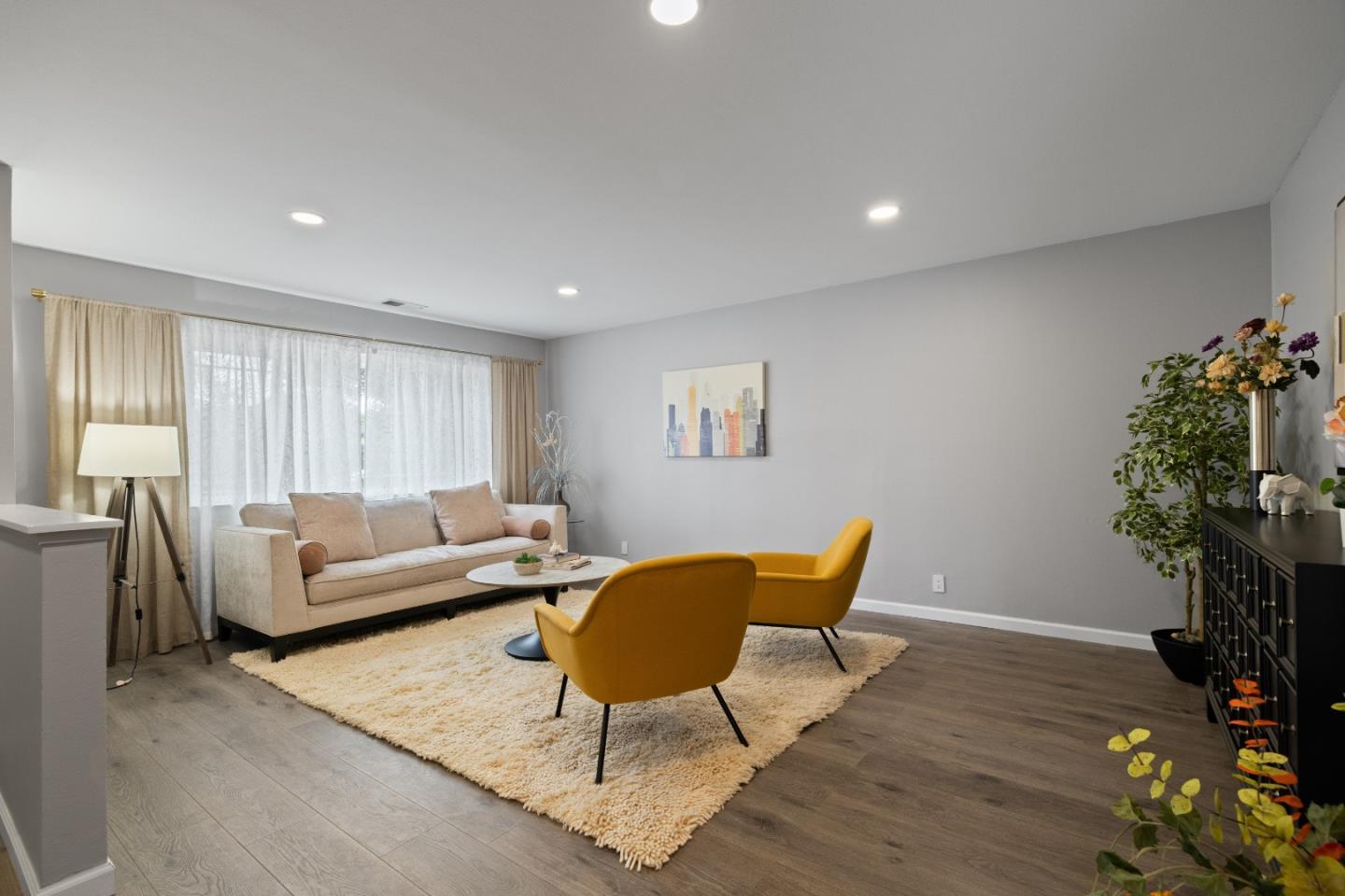 227 Lippert Avenue Fremont, CA 94539 - Photo 3 of 25 a living room with furniture a potted plant and a wooden floor
