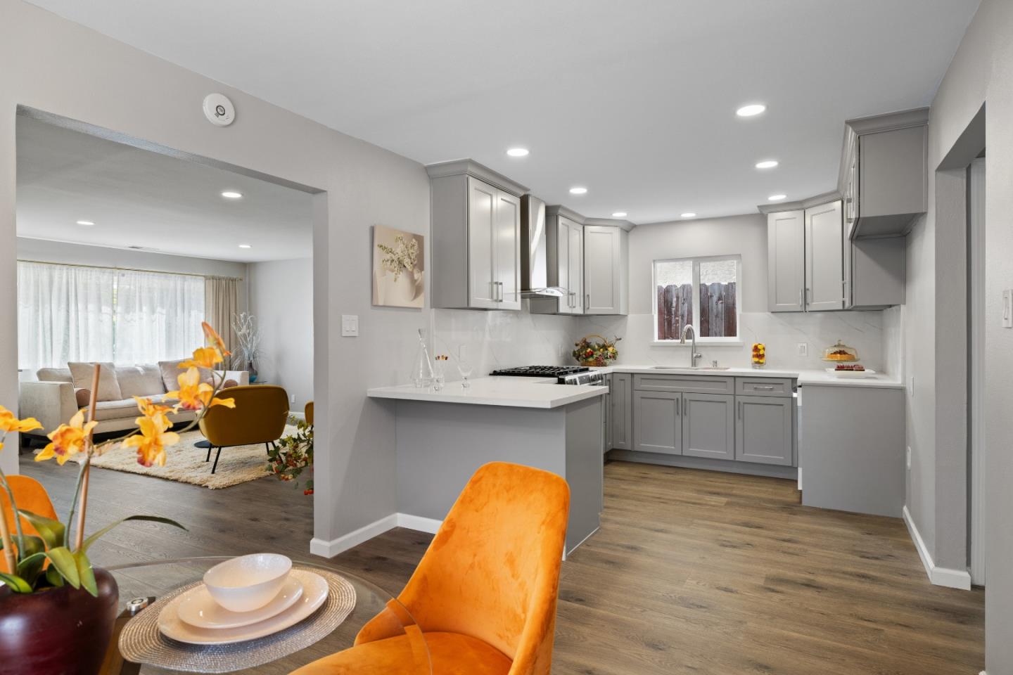 227 Lippert Avenue Fremont, CA 94539 - Photo 8 of 25 a kitchen with a sink cabinets and wooden floor