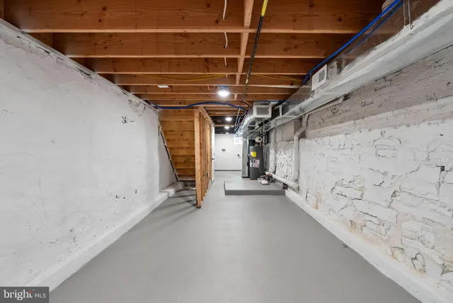 a view of storage and utility room with stairs