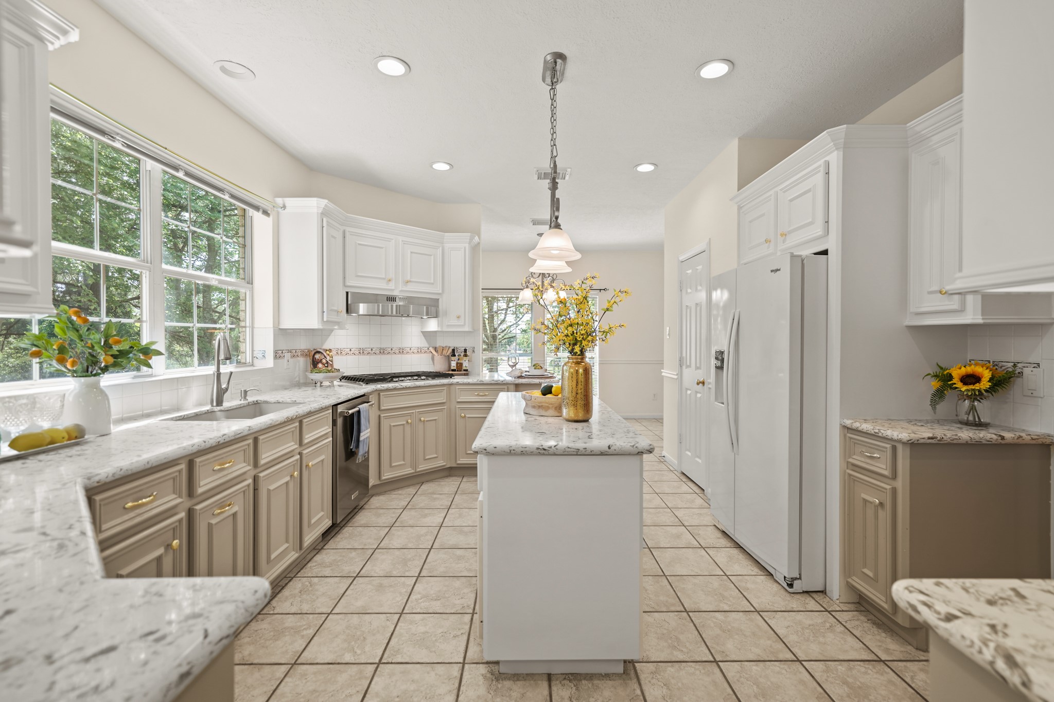 12690 Longmire Way Conroe, TX 77304 - Photo 12 of 50 a kitchen with a sink a counter top space stainless steel appliances and cabinets