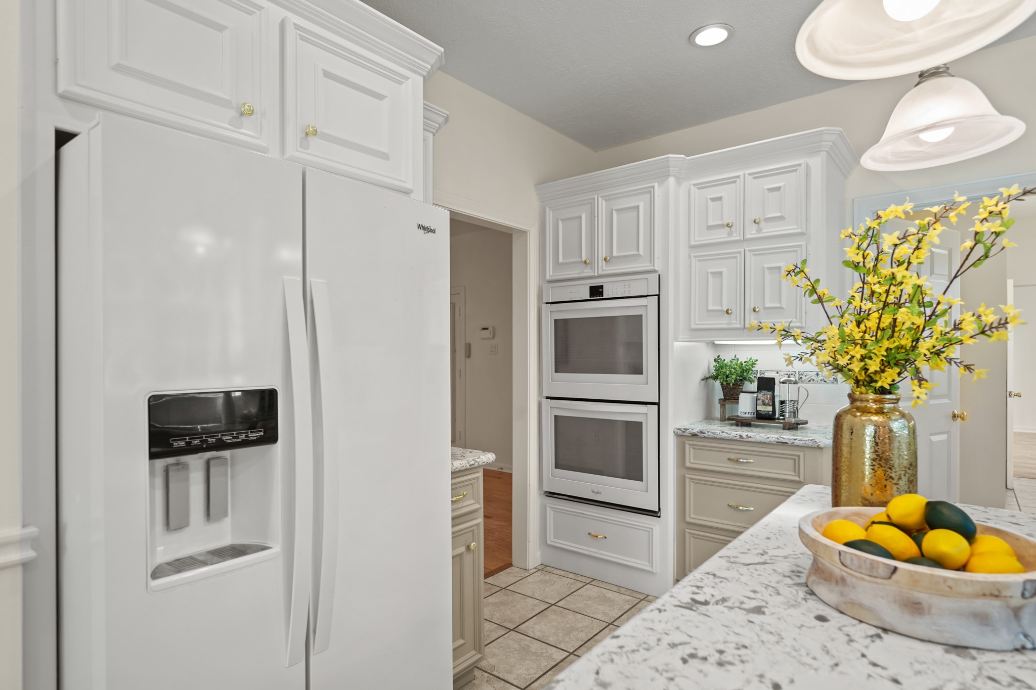 12690 Longmire Way Conroe, TX 77304 - Photo 14 of 50 A new portable microwave oven is tucked away just behind the cabinets to the right of the double ovens and as an added bonus, the side-by-side refrigerator/freezer with door mounted ice & water dispensers remains with the home.