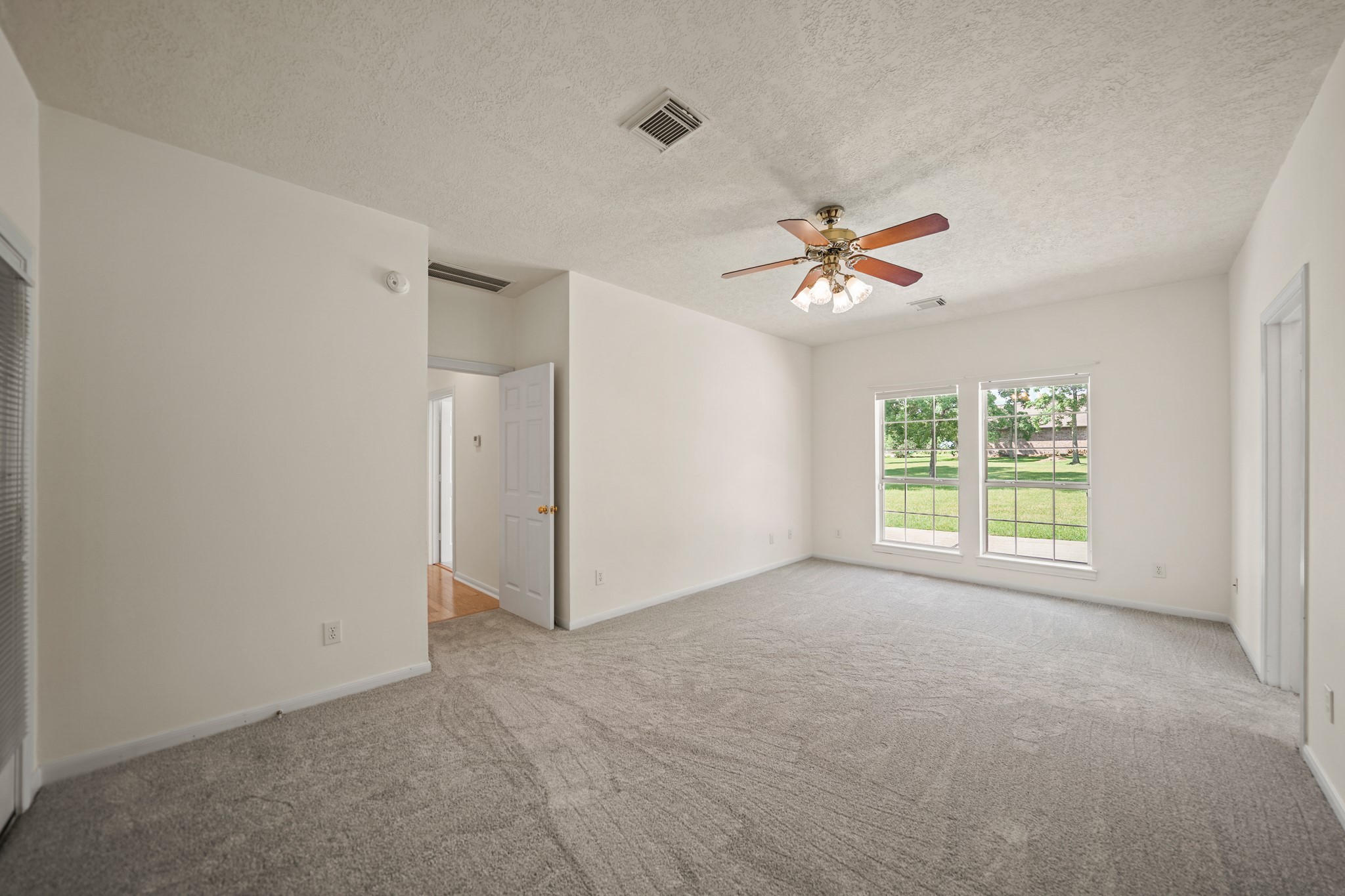 12690 Longmire Way Conroe, TX 77304 - Photo 22 of 50 a view of an empty room with a window