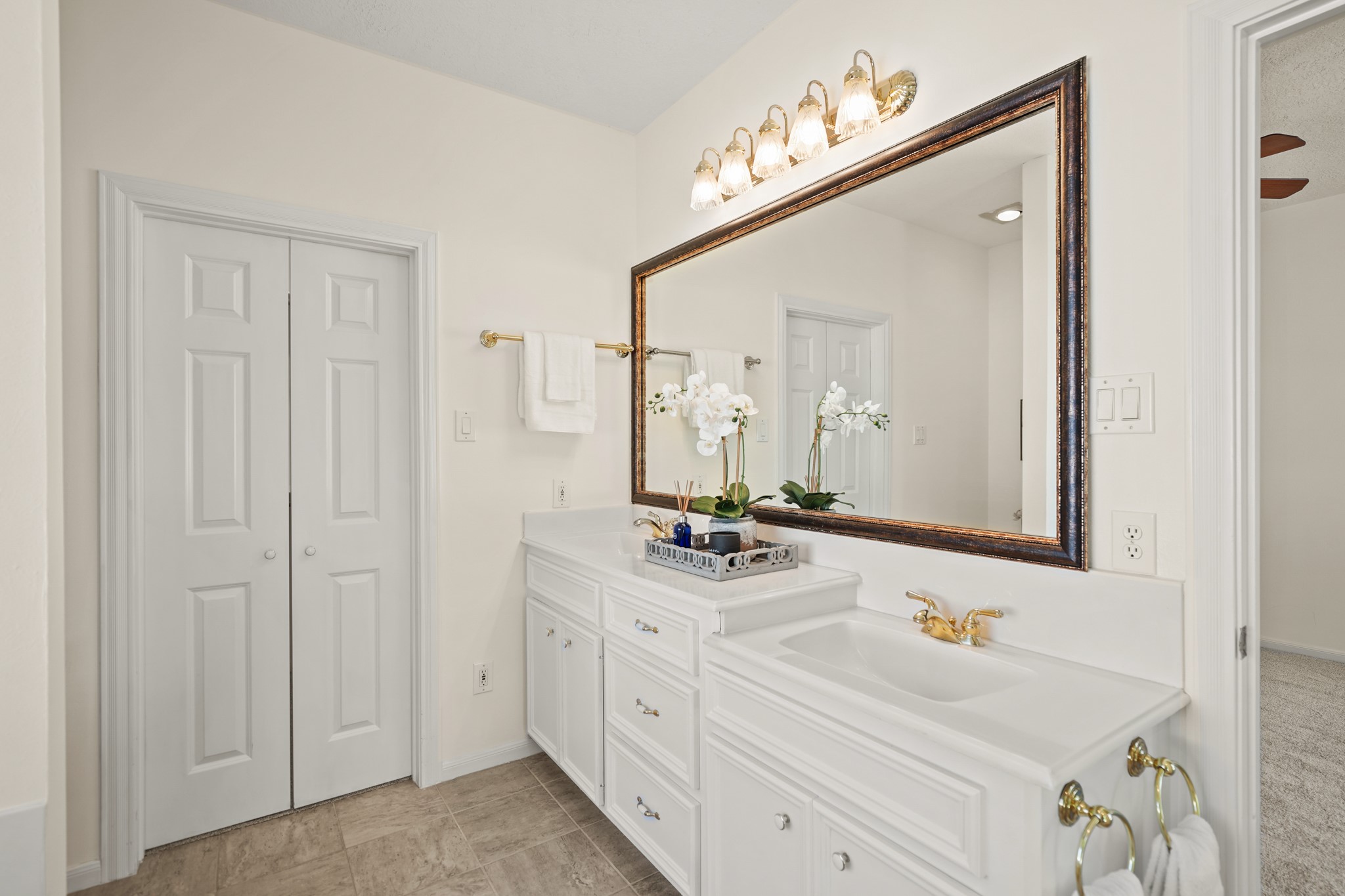 12690 Longmire Way Conroe, TX 77304 - Photo 25 of 50 Double doors open to a spacious walk-in wardrobe storage closet.