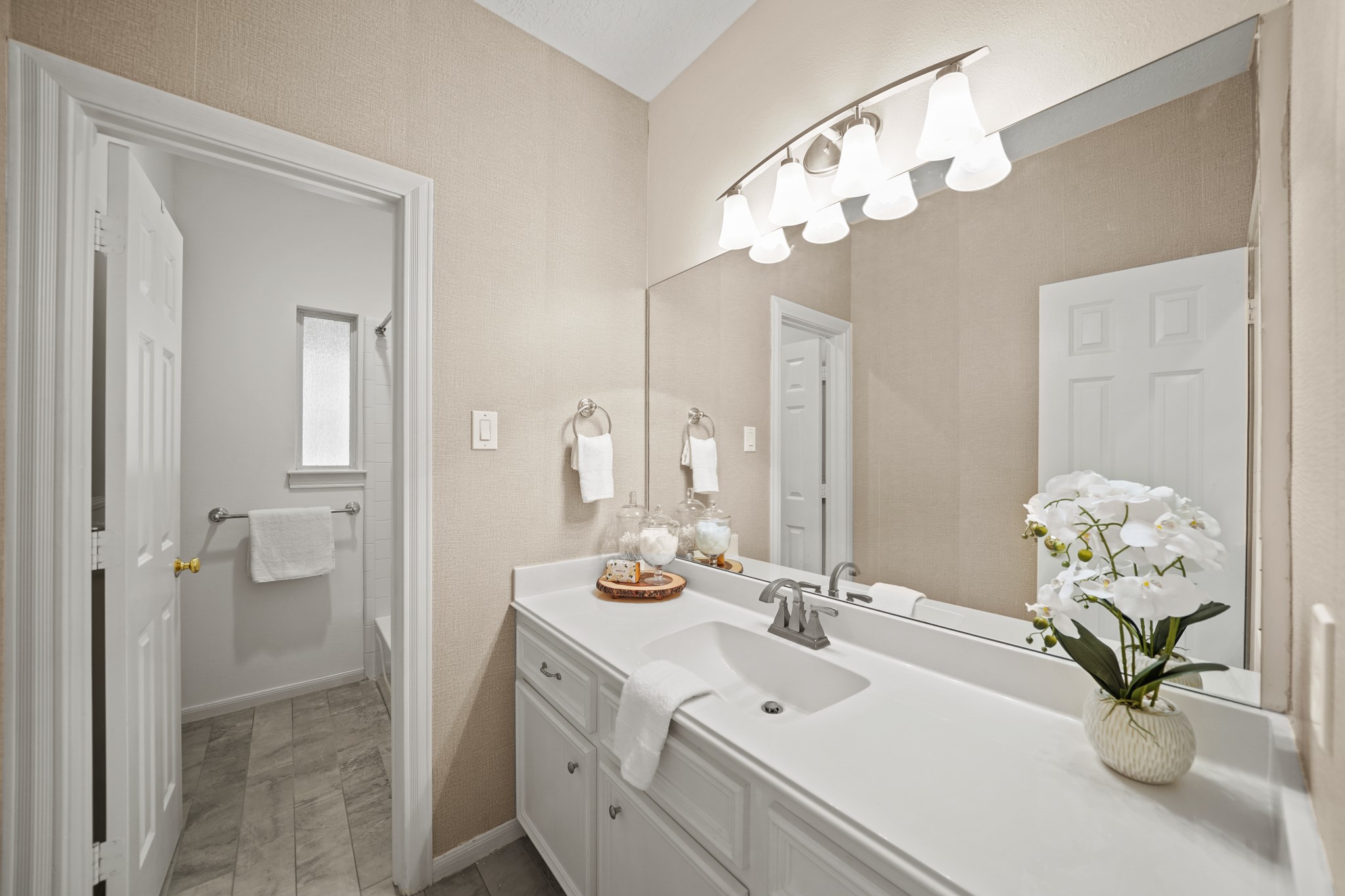 12690 Longmire Way Conroe, TX 77304 - Photo 33 of 50 a bathroom with a sink mirror and vanity