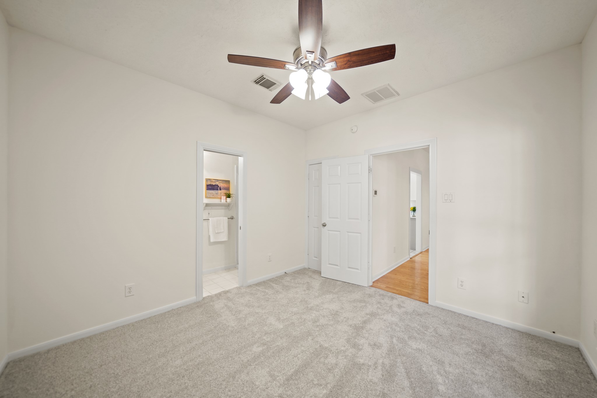 12690 Longmire Way Conroe, TX 77304 - Photo 39 of 50 an empty room with fan and windows