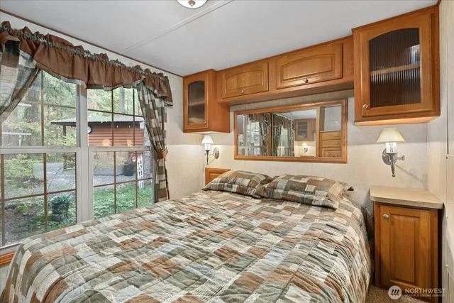 a bedroom with a bed and a closet