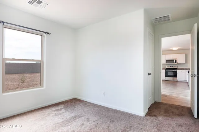 a bathroom with a granite countertop sink toilet a mirror and bathtub