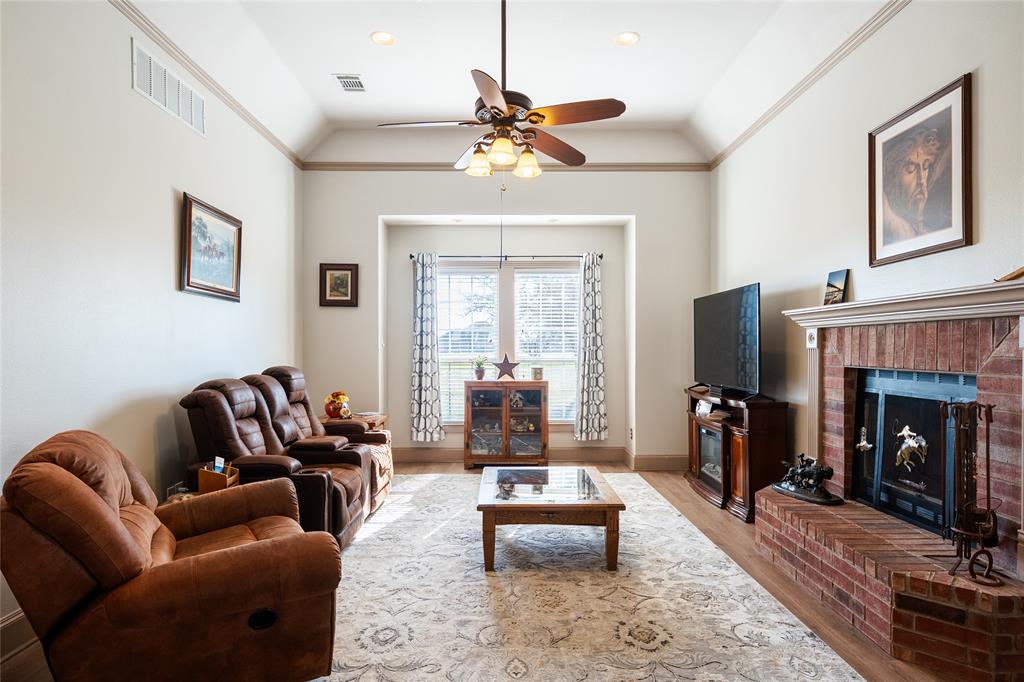 2211 Mc Alpin Road Midlothian, TX 76065 - Photo 11 of 37 a living room with furniture and a fireplace