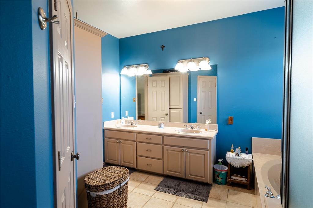 2211 Mc Alpin Road Midlothian, TX 76065 - Photo 15 of 37 a bathroom with a sink mirror and toilet