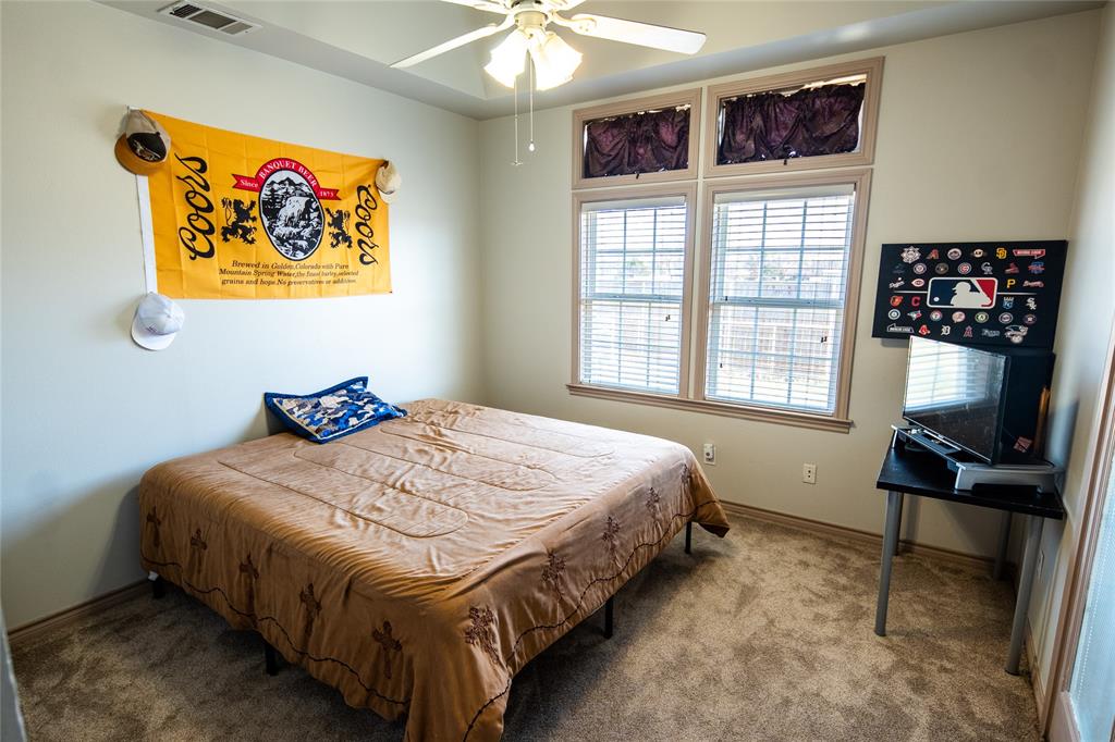 2211 Mc Alpin Road Midlothian, TX 76065 - Photo 16 of 37 a bedroom with a bed and a window
