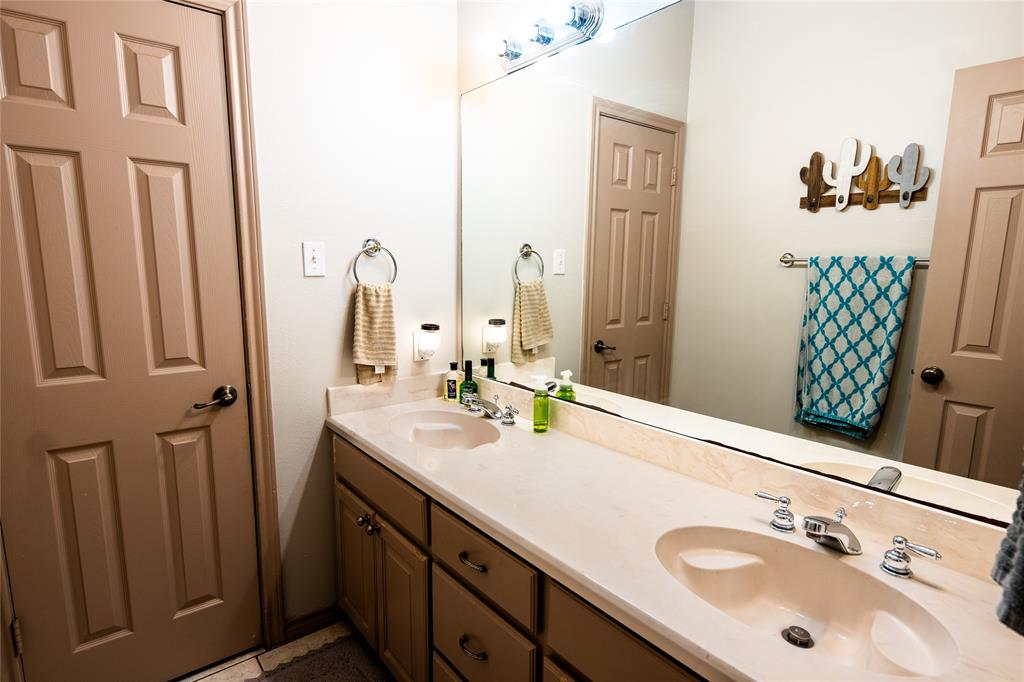 2211 Mc Alpin Road Midlothian, TX 76065 - Photo 18 of 37 a bathroom with a sink vanity and a mirror