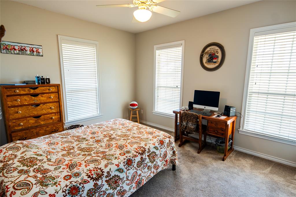 2211 Mc Alpin Road Midlothian, TX 76065 - Photo 19 of 37 a bedroom with a bed and a television