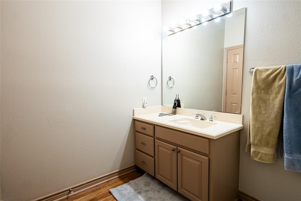 2211 Mc Alpin Road Midlothian, TX 76065 - Photo 22 of 37 a bathroom with a sink and mirror