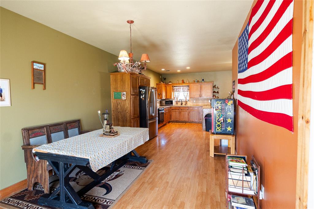 2211 Mc Alpin Road Midlothian, TX 76065 - Photo 28 of 37 a dining room with furniture and wooden floor