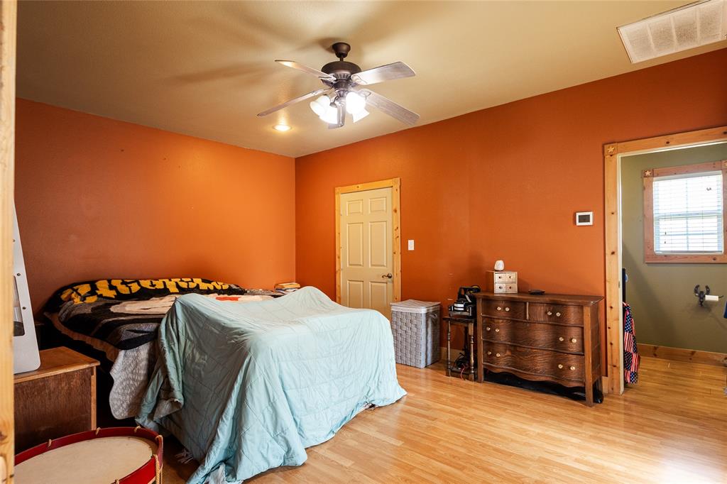 2211 Mc Alpin Road Midlothian, TX 76065 - Photo 30 of 37 a bedroom with a bed and dresser