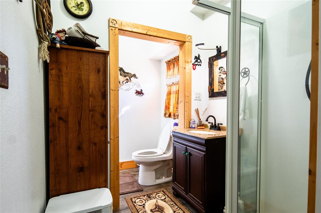 2211 Mc Alpin Road Midlothian, TX 76065 - Photo 34 of 37 a bathroom with a toilet sink and shower