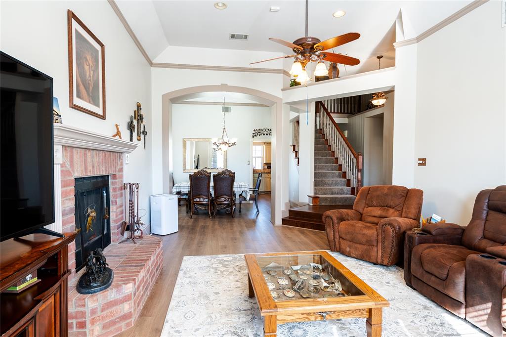 2211 Mc Alpin Road Midlothian, TX 76065 - Photo 10 of 37 a living room with furniture fireplace and a table