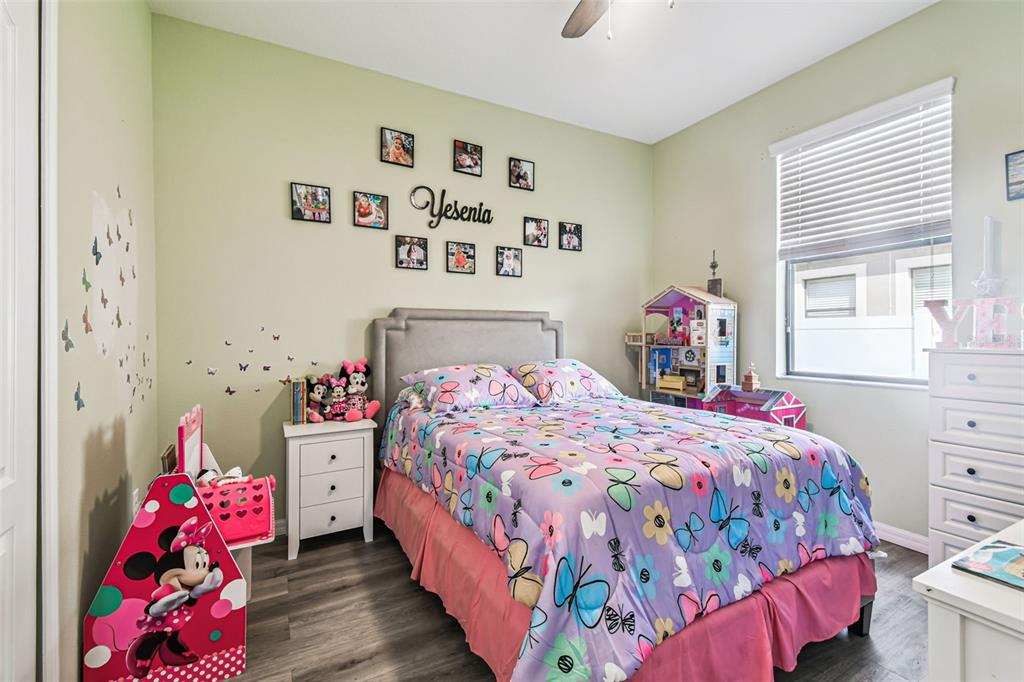 13807 Felix Will Road Riverview, FL 33579 - Photo 15 of 91 a bedroom with a bed and a dresser in it