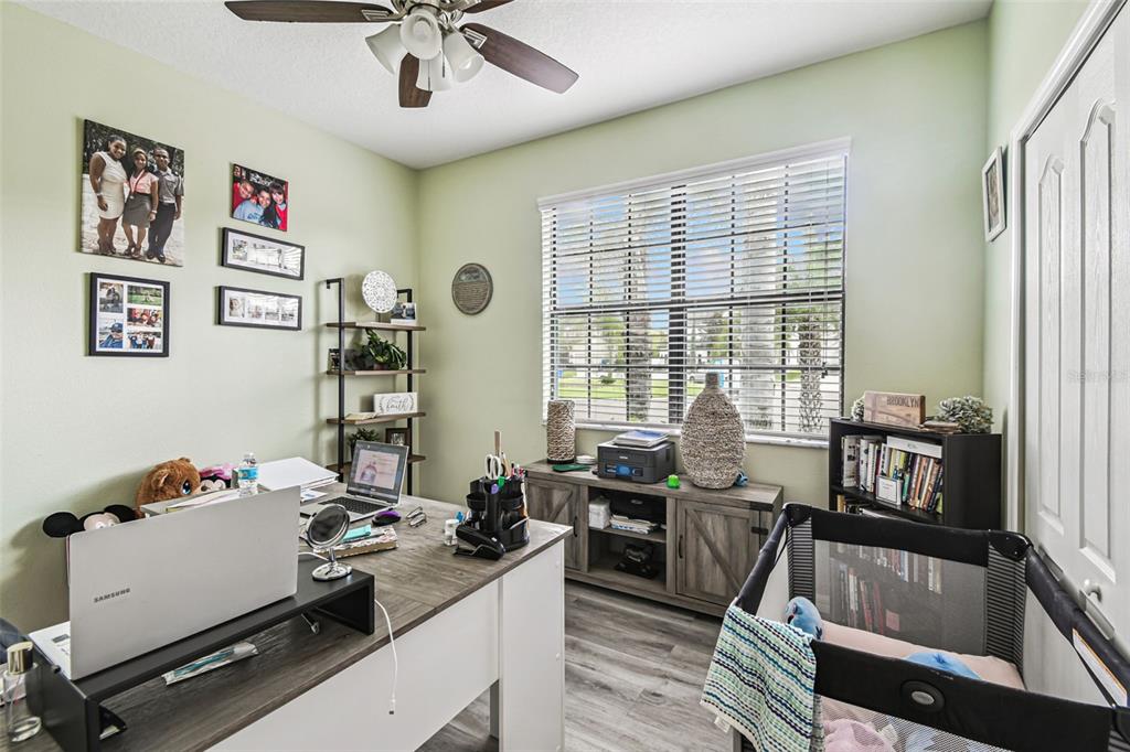 13807 Felix Will Road Riverview, FL 33579 - Photo 21 of 91 a room with furniture a flat screen tv and a window