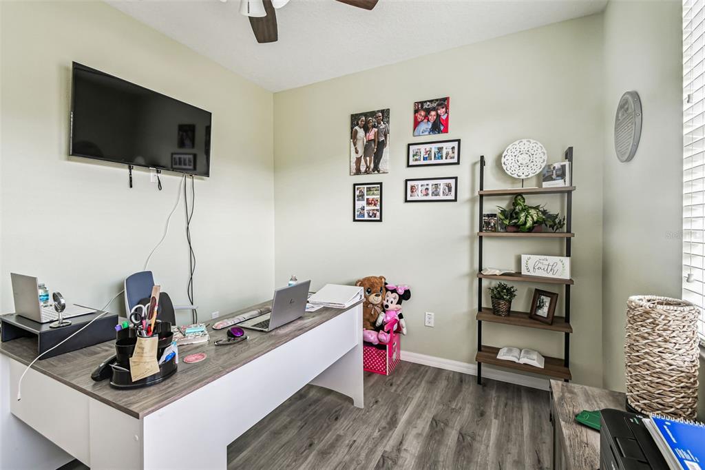 13807 Felix Will Road Riverview, FL 33579 - Photo 22 of 91 a living room with furniture and a flat screen tv