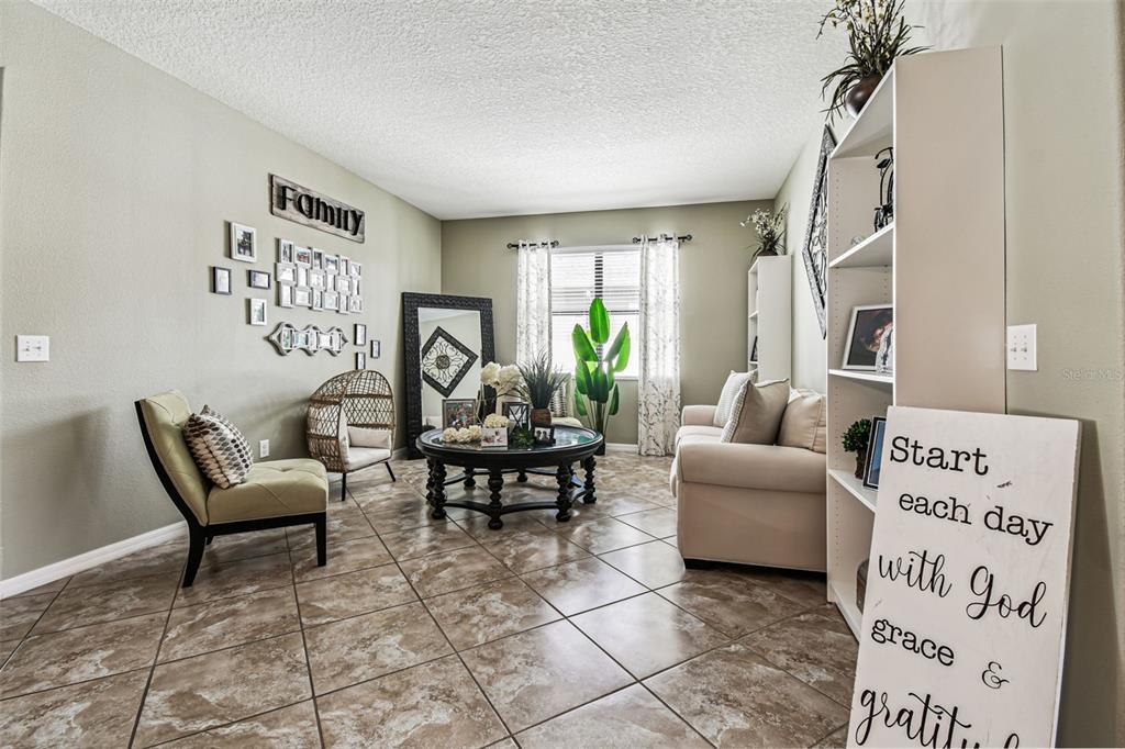 13807 Felix Will Road Riverview, FL 33579 - Photo 30 of 91 a living room with furniture and a window