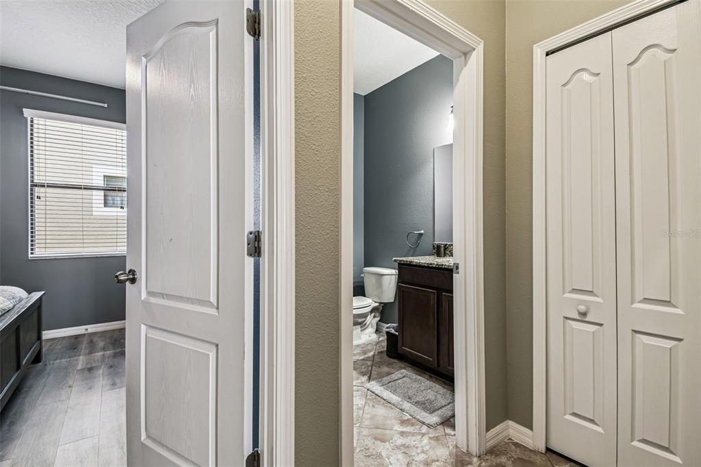 13807 Felix Will Road Riverview, FL 33579 - Photo 34 of 91 a view of a hallway with closet and a livingroom view