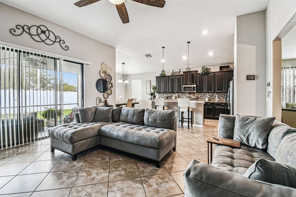 13807 Felix Will Road Riverview, FL 33579 - Photo 52 of 91 a living room with furniture and a large window