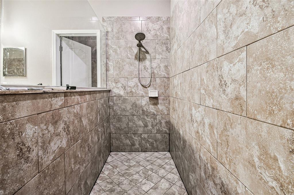 13807 Felix Will Road Riverview, FL 33579 - Photo 66 of 91 a bathroom with a shower
