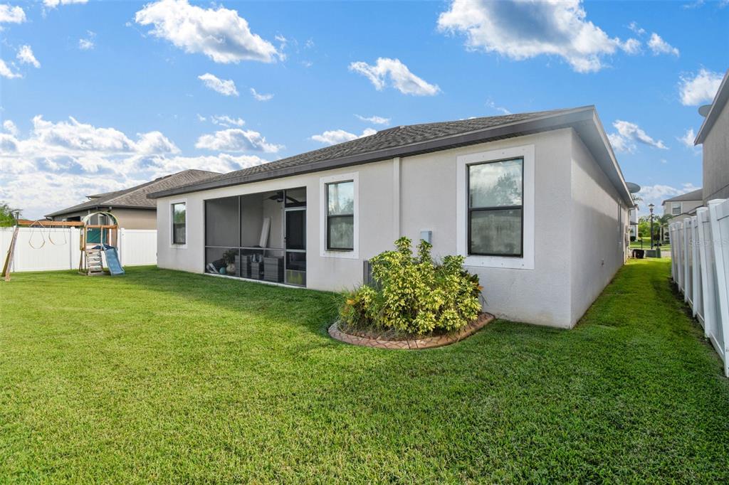 13807 Felix Will Road Riverview, FL 33579 - Photo 70 of 91 a front view of house with a garden