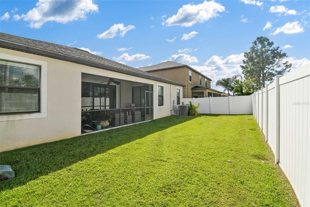 13807 Felix Will Road Riverview, FL 33579 - Photo 72 of 91 a view of a backyard with a garden
