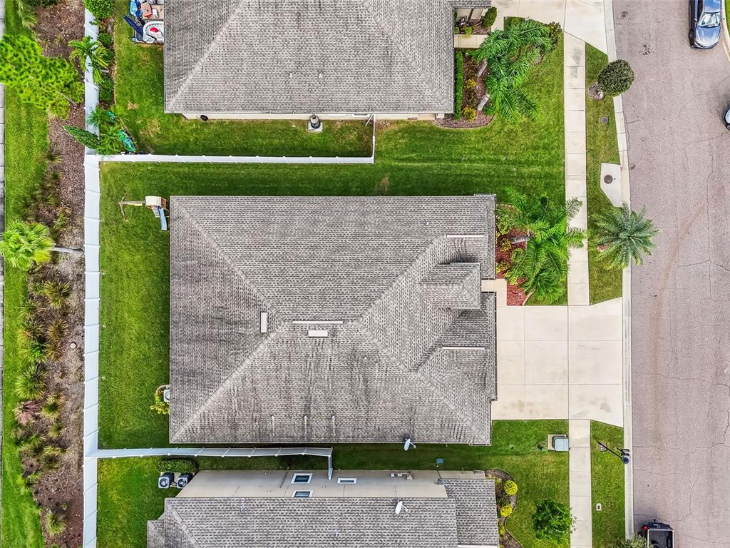 13807 Felix Will Road Riverview, FL 33579 - Photo 85 of 91 an aerial view of a house with a yard and green space