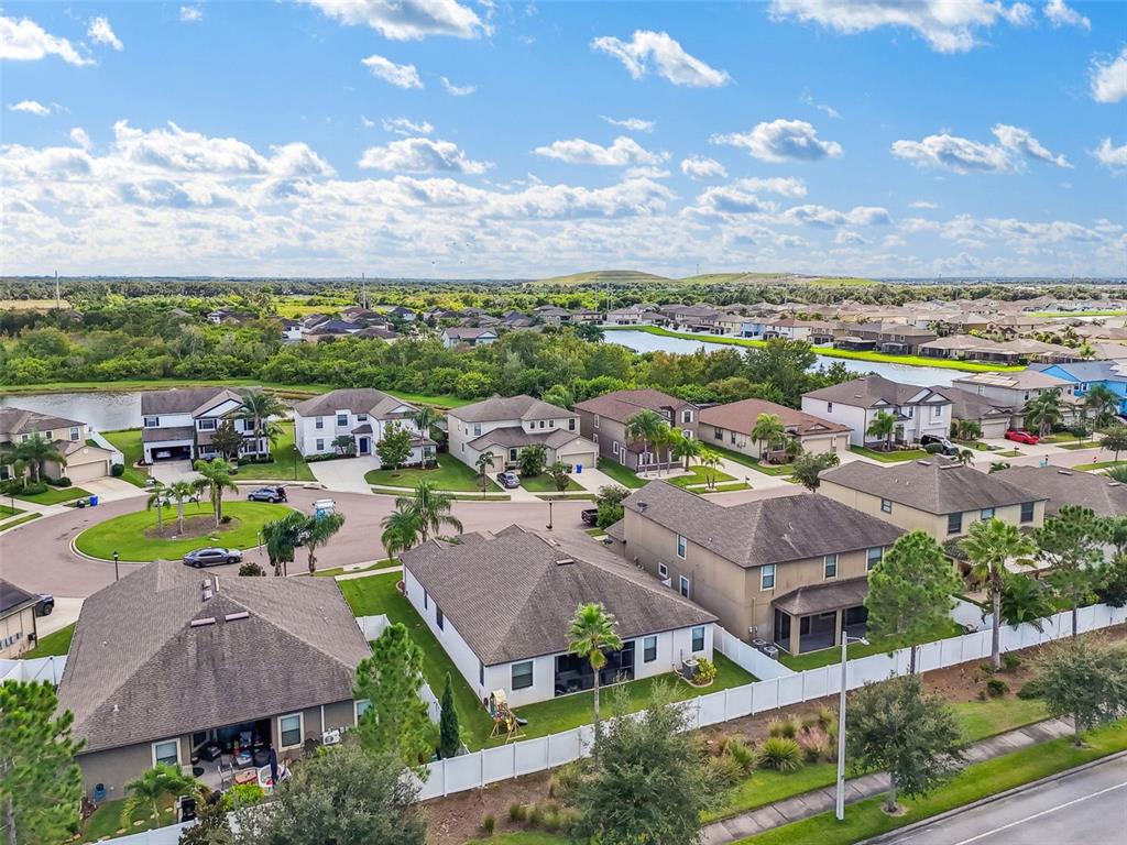 13807 Felix Will Road Riverview, FL 33579 - Photo 91 of 91 an aerial view of residential houses with outdoor space and ocean view