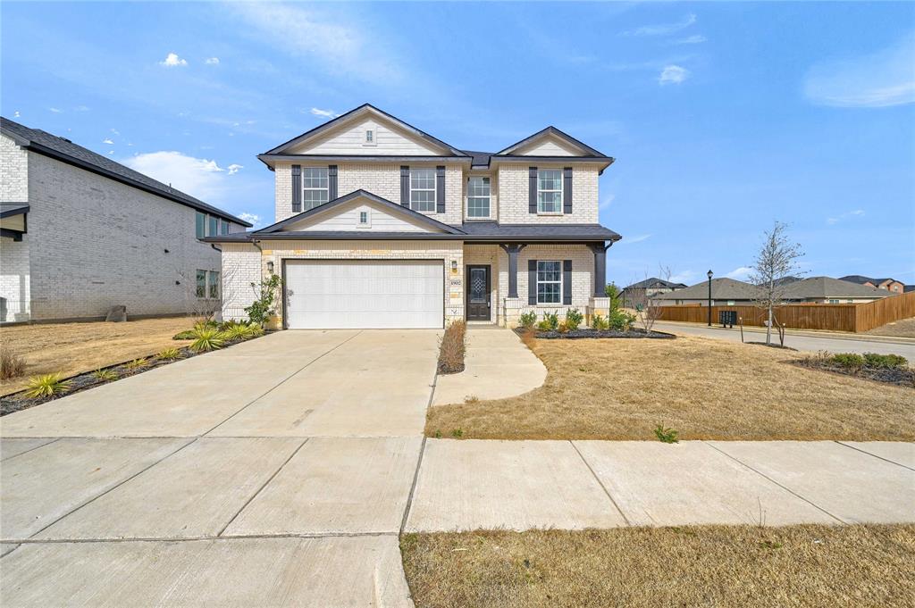 1902 Aleia Cove Sherman, TX 75092 - Photo 1 of 25 a front view of a house with a yard
