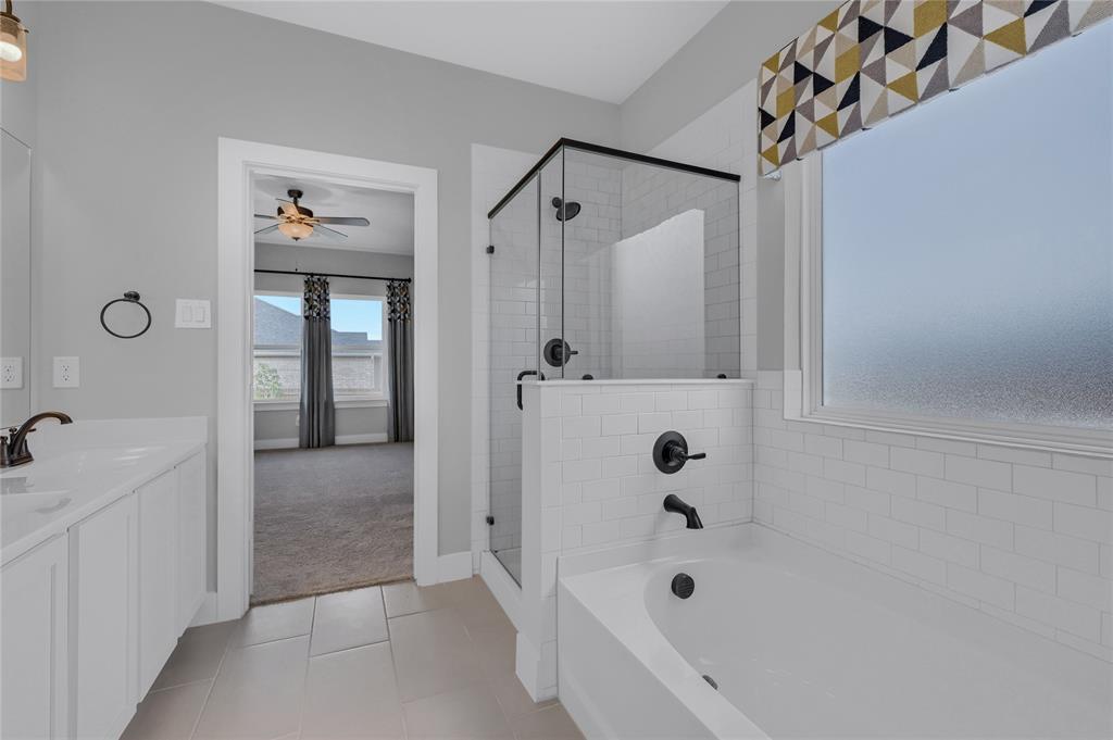 1902 Aleia Cove Sherman, TX 75092 - Photo 13 of 25 a bathroom with a bathtub and shower