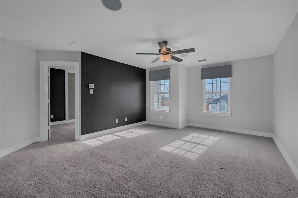 1902 Aleia Cove Sherman, TX 75092 - Photo 17 of 25 a view of a livingroom with a ceiling fan and window
