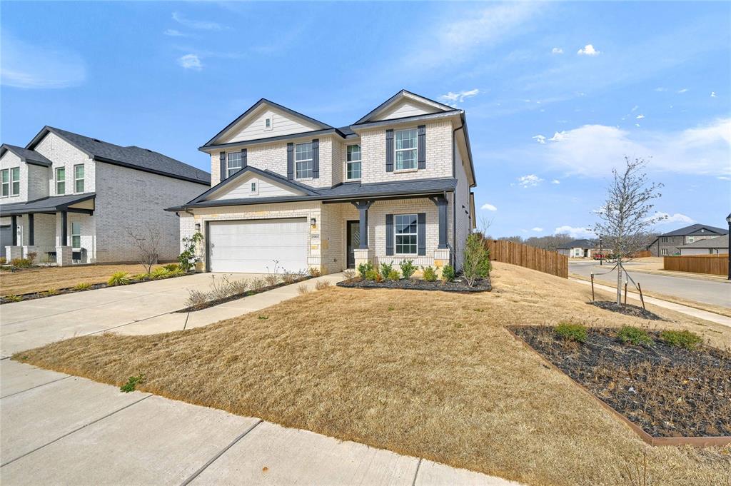 1902 Aleia Cove Sherman, TX 75092 - Photo 2 of 25 a front view of a house with a yard