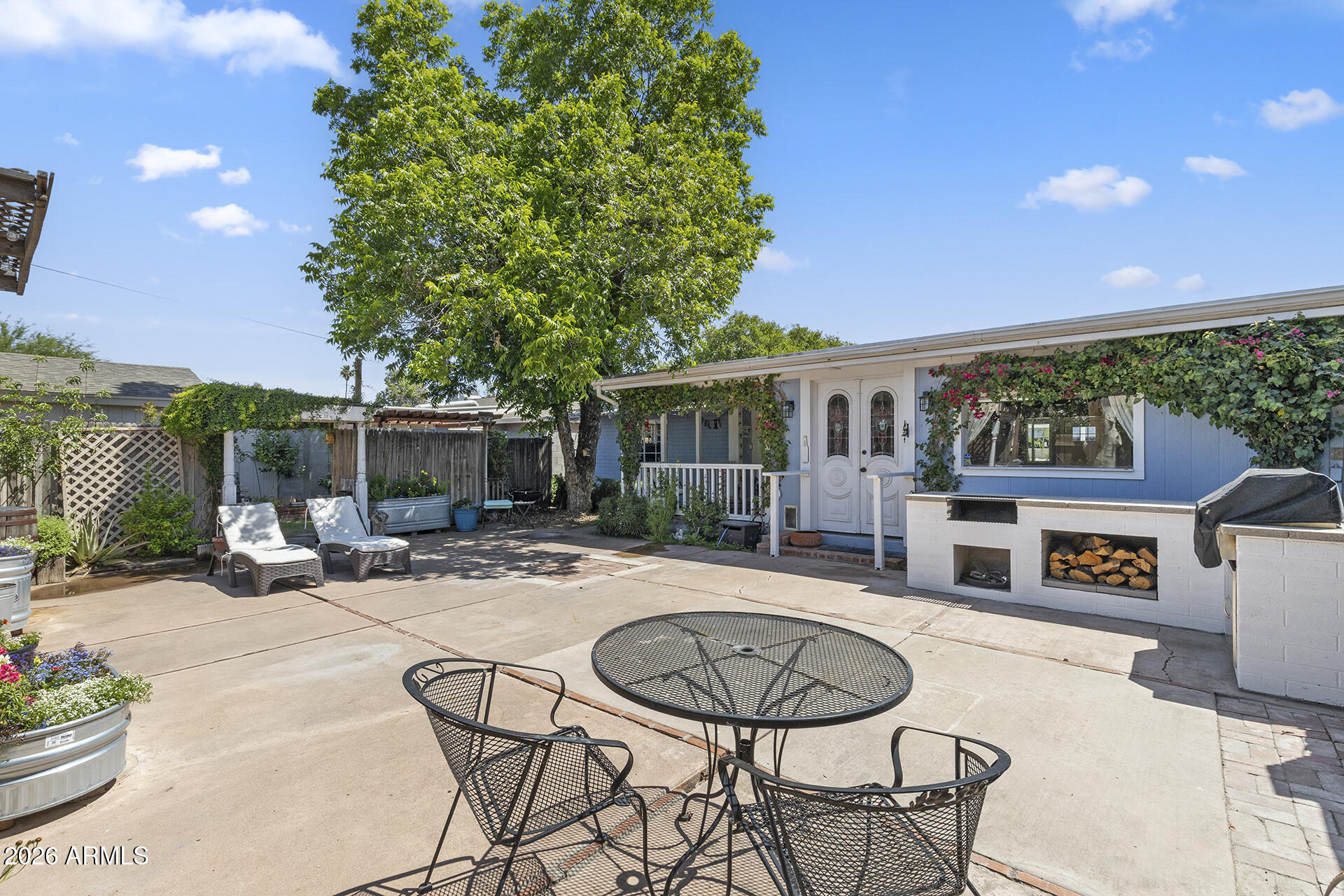 5228 North 15th Street Phoenix, AZ 85014 - Photo 46 of 96 a outdoor space with furniture and a fireplace