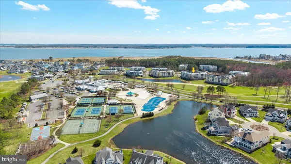 an aerial view of a swimming pool and lake view