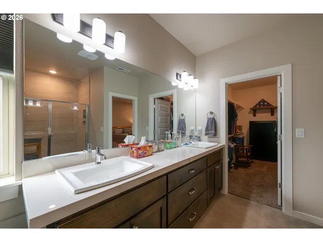a bathroom with a sink double vanity and a mirror