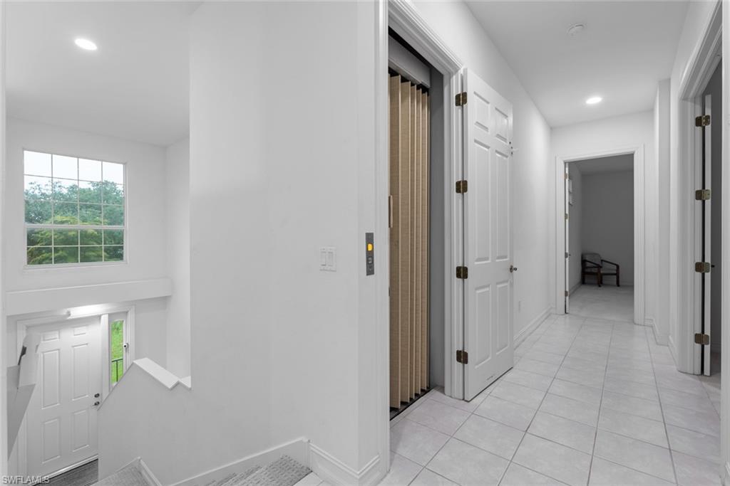 5017 Maxwell Circle, Unit 4202 Naples, FL 34105 - Photo 3 of 27 Private elevator and hallway