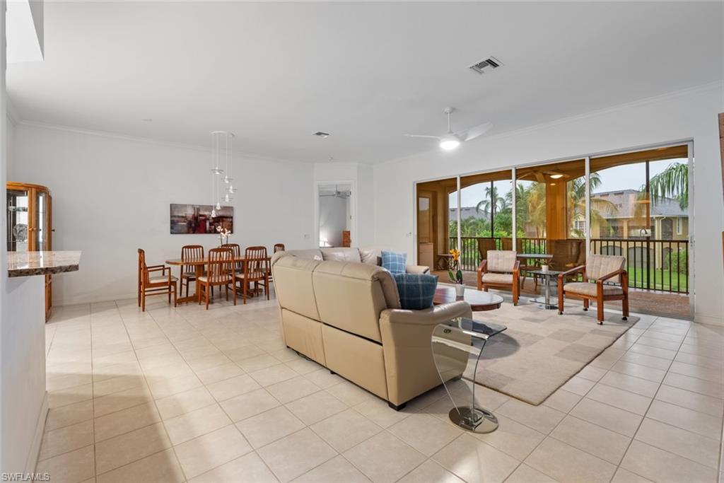 5017 Maxwell Circle, Unit 4202 Naples, FL 34105 - Photo 7 of 27 Living room with dining area in the background