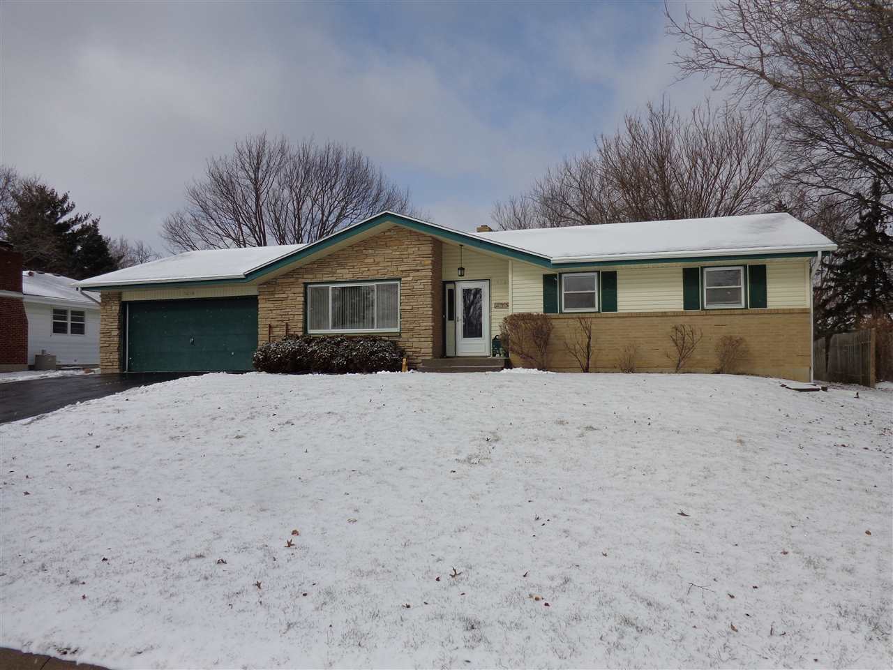 5240 Welsh Road Rockford, IL 61107 - Photo 1 of 25 a front view of a house with a yard
