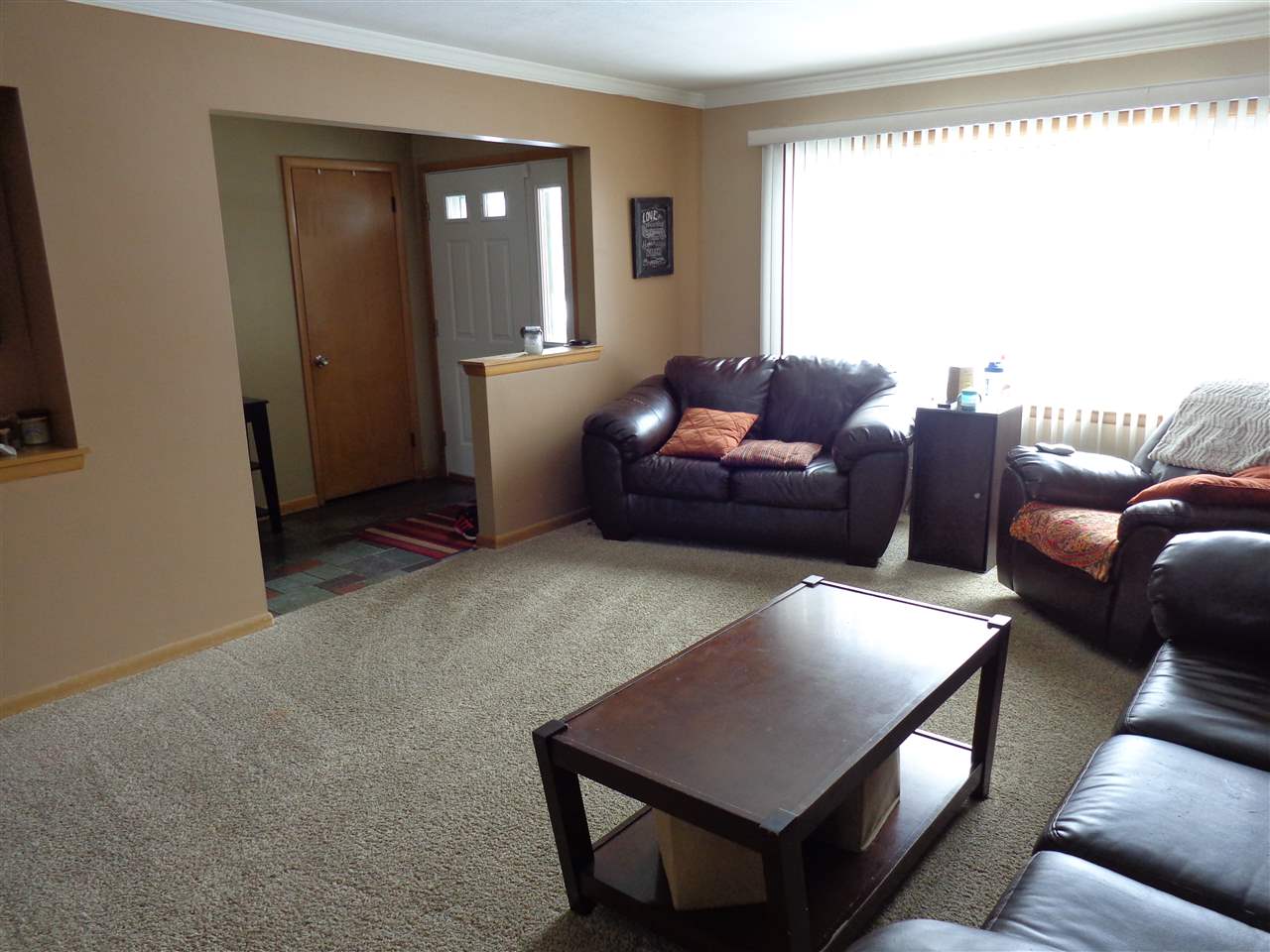 5240 Welsh Road Rockford, IL 61107 - Photo 11 of 25 a living room with furniture and a window